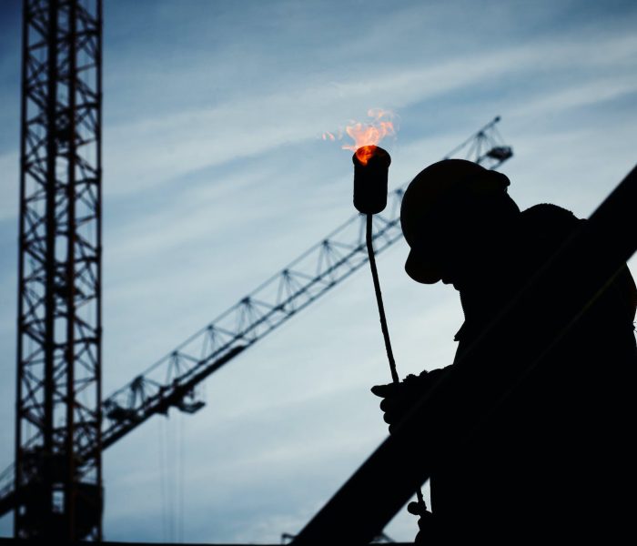 pexels-photo-585418 silhouette of man holding flamethrower